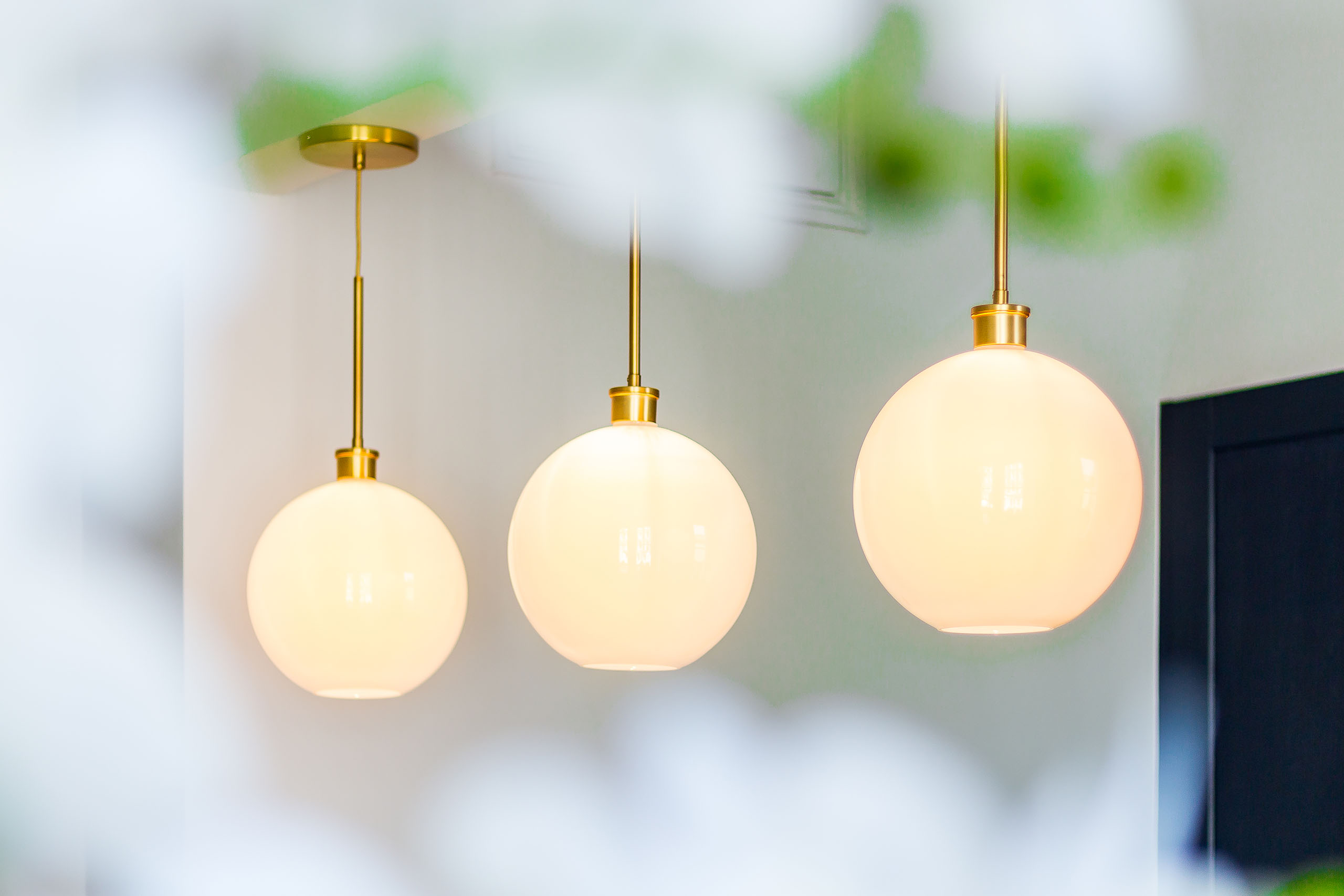 Three hanging ball light fittings in a living room