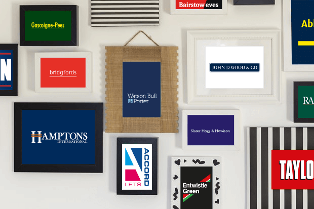 Selection of Countrywide estate agency brand logos displayed in photo frames