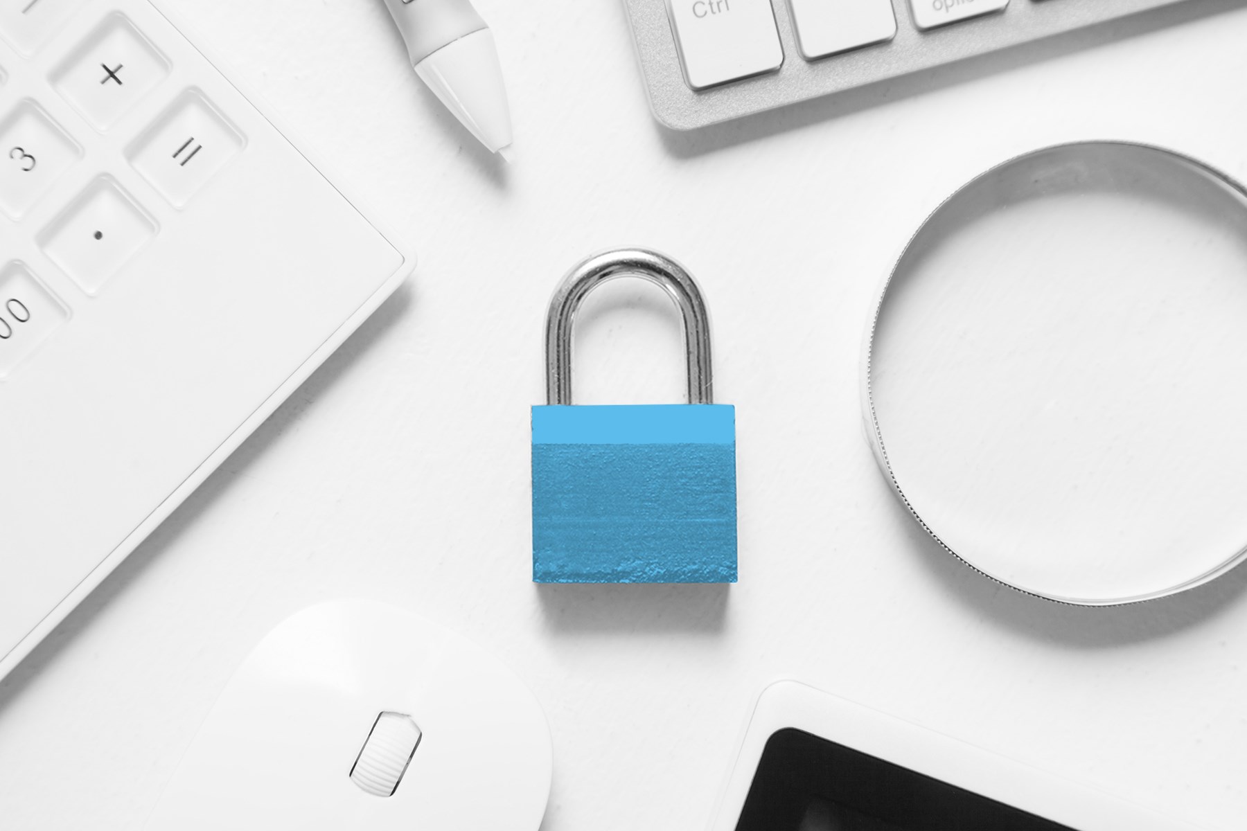Blue padlock on a white background with stationary items